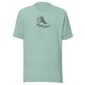 Minimalist Hiking boot silhouette with rainbow laces, upper center chest on Bella + Canvas heather prism dusty blue unisex tshirt.