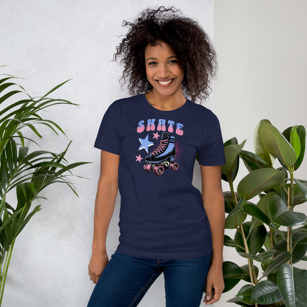 Model wearing skate in retro typography in blue and pink above a classic quad skate also in blue and pink on navy bella + canvas unisex tee. Paired with jeggings.