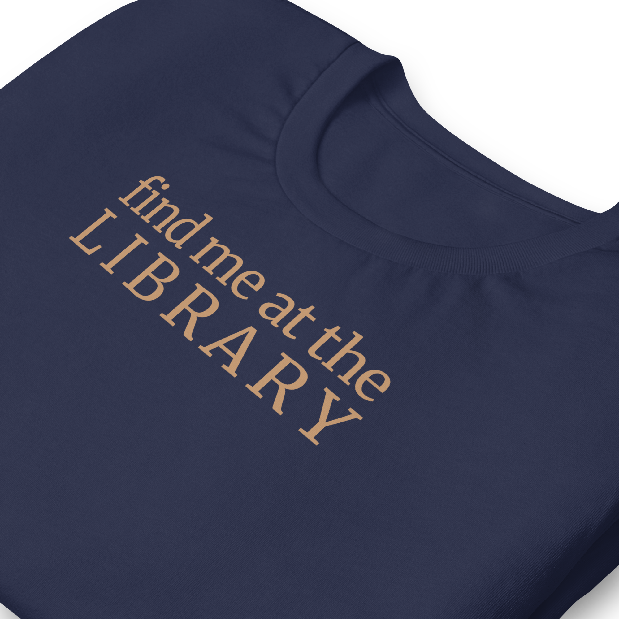 "Find Me at the Library" minimalist typography tee. On Bella + Canvas unisex cotton. Terra cotta ink on navy blue shirt. close up.