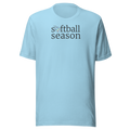 Minimalist typography "softball season" with the O replaced by a rainbow softball graphic. Off black ink on unisex  Bella + Canvas cotton ocean blue shirt. Center chest