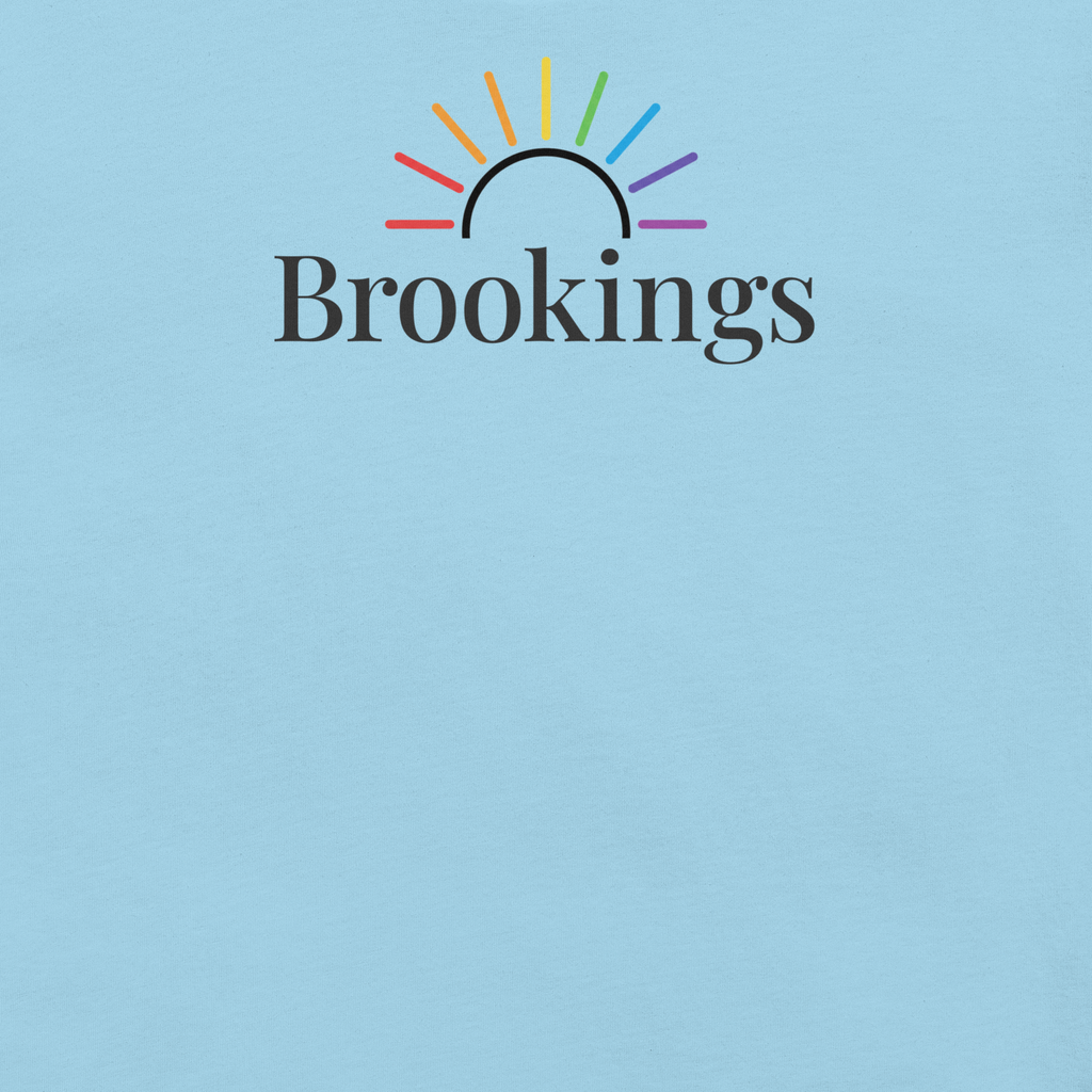 Brookings typography under rainbow sun arc on soft, unisex Bella + Canvas tshirt. Center Chest, ocean blue cotton. Close up