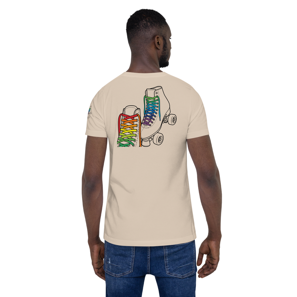 Model wearing beige shirt with outline of 2 quad skates with LGBTQ+ rainbow laces. Printed on back paired with jeans. Bella + canvas unisex cotton