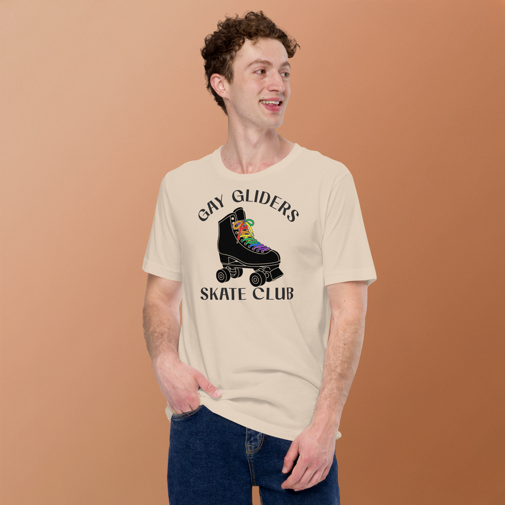 Model wearing badge style Gay Gliders Skate Club. Classic Black skate with LGBTQ+ rainbow laces. Unisex beige Bella + Canvas cotton tee.