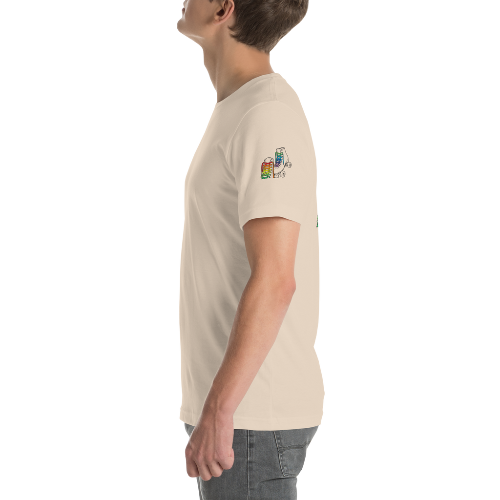 Side view of model wearing beige shirt with outline of 2 quad skates with LGBTQ+ rainbow laces. Printed on left sleeve paired with jeans. Bella + canvas unisex cotton