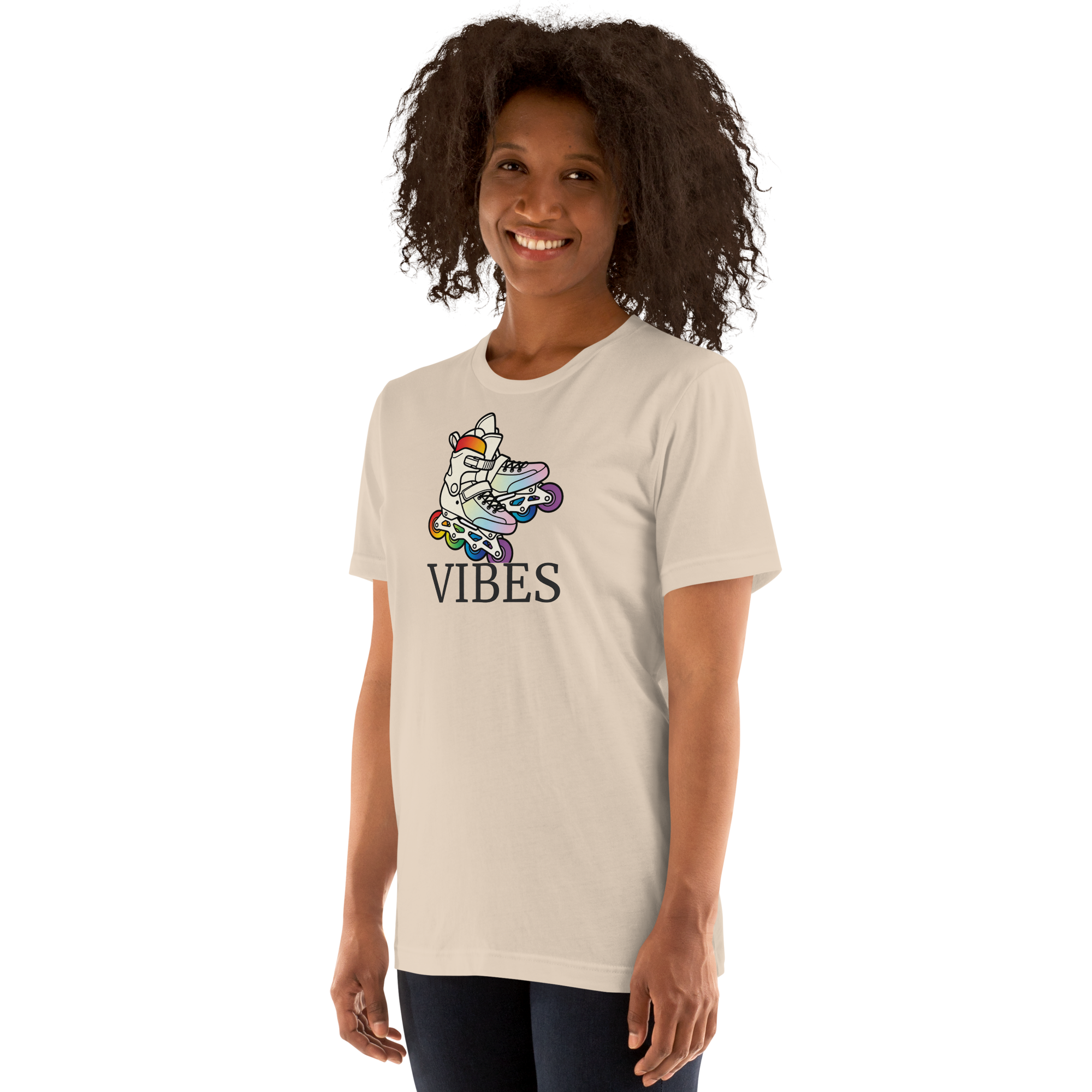 Model wearing 2 inline skates in LGBTQ+ rainbow colors above VIBES text. Beige Bella + Canvas Cotton.  Paired with jeggings.